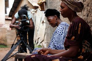 Rosine Mbakam, left, says she chose to shoot all images and sound herself to maintain an equal relationship with the subjects of her films.